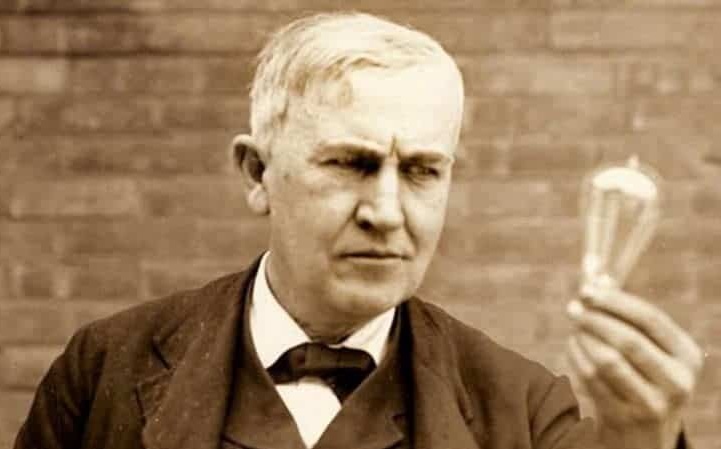 Thomas Edison examining one of his early lightbulb designs, symbolizing a moment of innovation and discovery, paralleling the author's lightbulb moment during the COVID-19 pandemic, when he realized AI’s transformative potential in revolutionizing enterprise integration